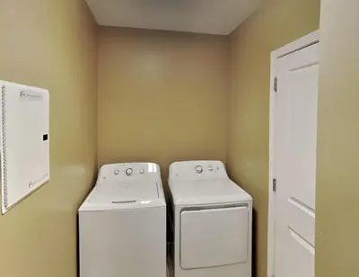 a laundry room with a washer and dryer at Grandview East #1305 in Panama City Beach