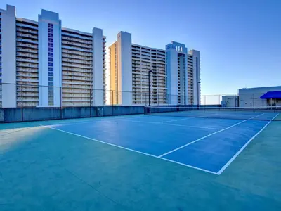 a tennis court in front of some tall buildings at Majestic Beach Towers I #914 in Panama City Beach
