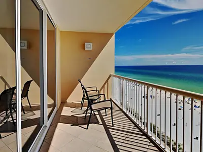 a balcony with chairs and a view of the ocean at Majestic Beach Towers I #914 in Panama City Beach