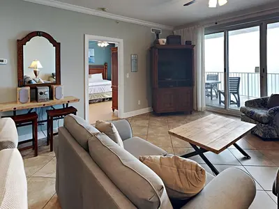 a living room with a couch and a table at Twin Palms #1805A in Panama City Beach