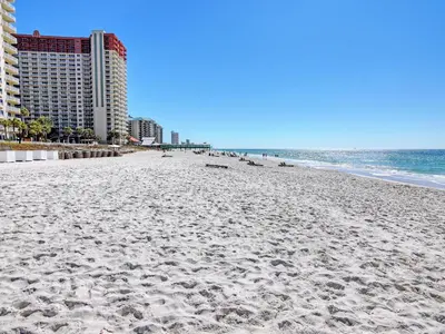 a sandy beach with buildings and the ocean at Long Beach Resort Tower II #202 in Panama City Beach