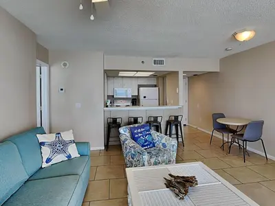 a living room with a couch and a table at Long Beach Resort Tower III #402 in Panama City Beach