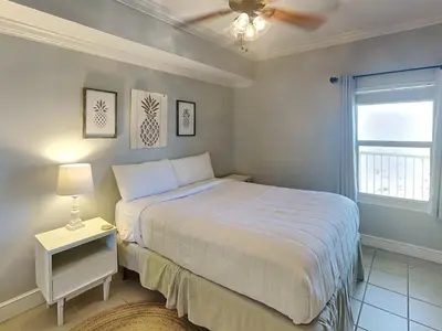 a bedroom with a bed and a ceiling fan at Majestic Beach Towers II #1902 in Panama City Beach