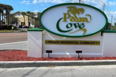 a sign for a pamoreore pharmacy on the side of a road at The Sand Castle in Panama City Beach