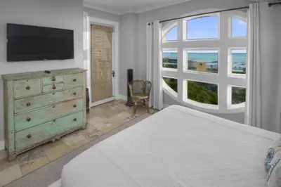 a bedroom with a bed and a dresser with a television at Amazing Gulf Views 425A WaterSound Crossings 3BR Steps to Beach and Pool! condo in Panama City Beach