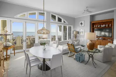 a dining room and living room with a table and chairs at Amazing Gulf Views 425A WaterSound Crossings 3BR Steps to Beach and Pool! condo in Panama City Beach
