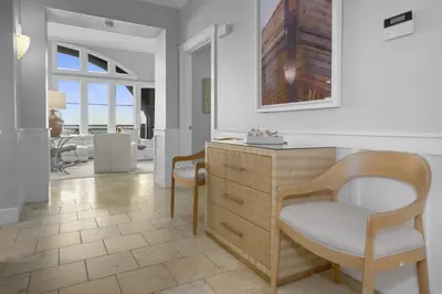 a living room with a chair and a desk at Amazing Gulf Views 425A WaterSound Crossings 3BR Steps to Beach and Pool! condo in Panama City Beach