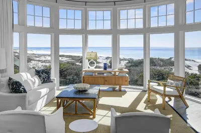 a living room with a view of the ocean at GULF FRONT PENTHOUSE CONDO COMPLIMENTARY GOLF CART 407 Compass Point 1, WaterSound - 3 BR, SLPS 8 condo in Panama City Beach