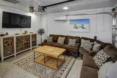 a living room with a couch and a table at Gulf Front Home in Seagrove Beach, FL with 3 Bedrooms and 3 Bathrooms home in Santa Rosa Beach