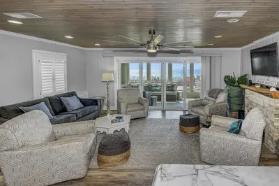 a living room with a couch and chairs and a tv at Gulf Front Home in Seagrove Beach, FL with 3 Bedrooms and 3 Bathrooms home in Santa Rosa Beach