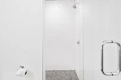 a shower with a roll of toilet paper in a bathroom at Private Pool and Short Walk to the Beach - Seagrove Beach FL home in Santa Rosa Beach