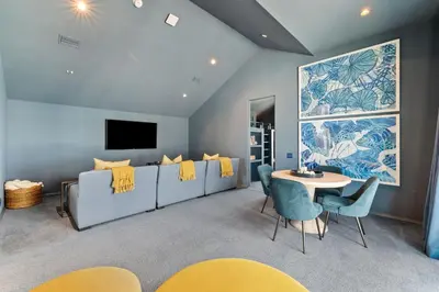 a living room with a couch and a table at Enchantment - Beach Front, Private Pool, Private Beach Access - 5BR 5BTH Home home in Panama City Beach