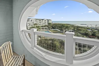 a room with a window with a view of the beach at AMAZING GULF VIEWS 420B WaterSound Crossings 3BR, Corner Unit condo in Panama City Beach