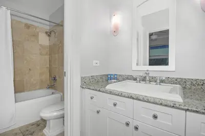 a white bathroom with a sink and a toilet at AMAZING GULF VIEWS 420B WaterSound Crossings 3BR, Corner Unit condo in Panama City Beach