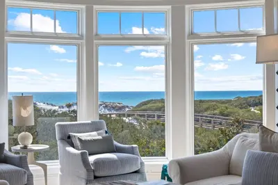 a living room with a view of the ocean at GULF VIEWS from ALL Bedrooms! 308 Compass Point 1 in WaterSound - Short walk to the beach and pool condo in Panama City Beach