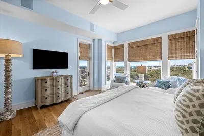a bedroom with a large bed and a tv at GULF VIEWS from ALL Bedrooms! 308 Compass Point 1 in WaterSound - Short walk to the beach and pool condo in Panama City Beach