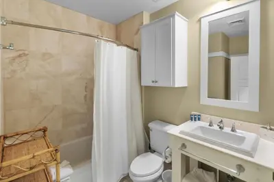 a bathroom with a toilet and a sink and a shower at NEW RENTAL Beach Front Condo in WaterSound Beach FL with Stunning Views! condo in Panama City Beach