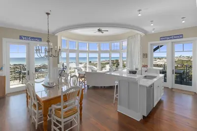 a kitchen and dining room with views of the ocean at NEW RENTAL Beach Front Condo in WaterSound Beach FL with Stunning Views! condo in Panama City Beach