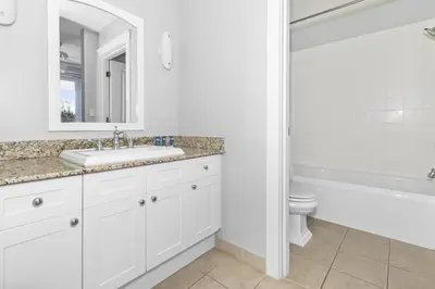 a bathroom with a sink and a tub and a toilet at Spacious, Gulf Views 110B WaterSound Crossings Steps to Beach and Pool condo in Panama City Beach
