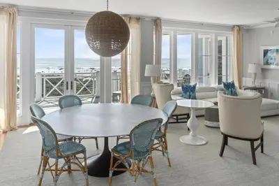 a living room with a table and chairs at BEAUTIFUL GULF VIEWS Spacious, Updated 316B WaterSound Crossings Steps to Beach and Pool condo in Panama City Beach