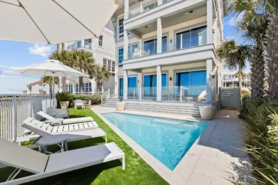 an image of a house with a swimming pool at Gulf Front Luxurious Home with Private Pool and Beach Access home in Panama City Beach