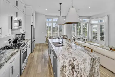 a kitchen with a large marble counter top at Gulf Views, Private Pool, Luxurious Home - Vista Del Mare home in Santa Rosa Beach