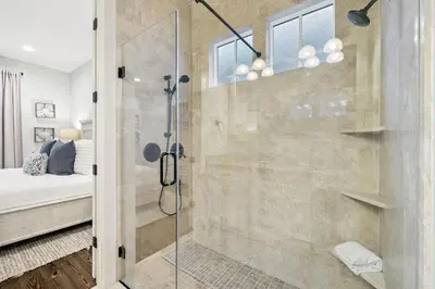 a bathroom with a shower with a glass door at Charming 4 BR Family Beach Retreat - 25 Half Moon, WaterSound West Beach home in Panama City Beach
