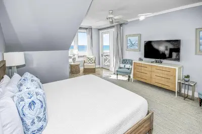 a bedroom with a large bed and a television at STUNNING GULF VIEWS - 3BR WaterSound Condo #426A - Steps to Beach and Pool condo in Panama City Beach
