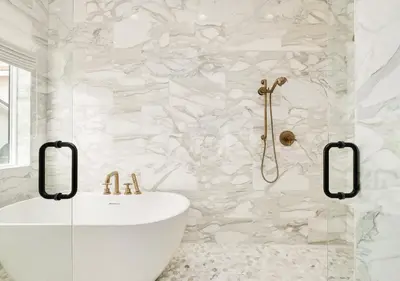 a bathroom with a white tub and a sink at Shellstone Cottage - Beach Front Seacrest Home with Private Pool and 5 Bedrooms home in Inlet Beach