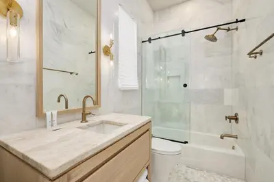 a bathroom with a sink and a shower at Shellstone Cottage - Beach Front Seacrest Home with Private Pool and 5 Bedrooms home in Inlet Beach