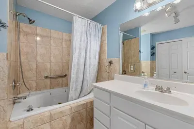 a bathroom with a sink and a shower and a tub at Pirates Cove - Private Pool, Seasonal Hot Tub, Game Room, Close to Beach, Pets OK in Panama City Beach