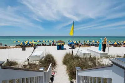 a view of the beach with umbrellas and the ocean at Sterling Breeze 804 in Panama City Beach