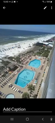 a view of a beach with two swimming pools and the ocean at The Summit Condo Resort in Panama City Beach