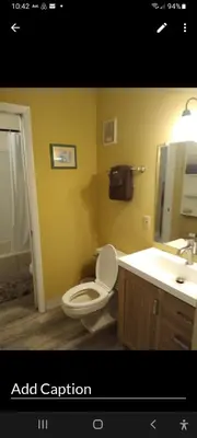 a bathroom with a white toilet and a sink at The Summit Condo Resort in Panama City Beach