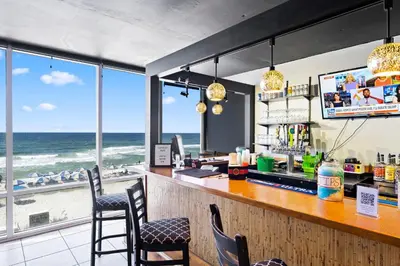 a bar with a view of the beach at Totally Beachin Unit 1302 in Panama City Beach