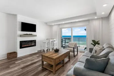 a living room with a couch and a fireplace at Summit 808 - Luxury Beach Resort Condo 1-6 People in Panama City Beach