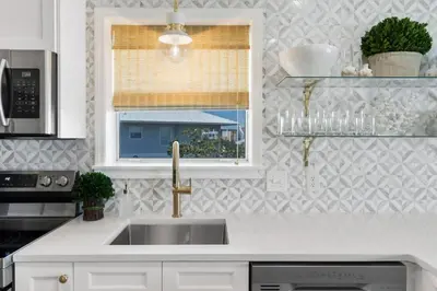 a kitchen with a sink and a window at Serenity by the Sea in Santa Rosa Beach
