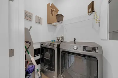 a kitchen with a washing machine in a room at Totally Beachin' in Inlet Beach