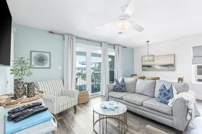 a living room with a couch and a table at Beachside Villas #731 in Santa Rosa Beach