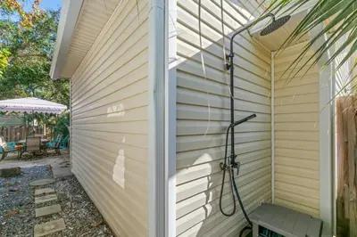 a shower in the side of a house at Fanta Sea - Private Seasonal Hot Tub, Game Room, Walk to Beach, Pets OK, & More! in Panama City Beach