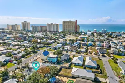 an aerial view of a city with buildings and the ocean at Fanta Sea - Private Seasonal Hot Tub, Game Room, Walk to Beach, Pets OK, & More! in Panama City Beach