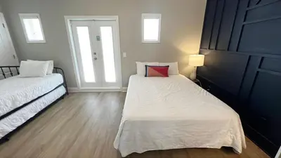 a bedroom with two beds and a window at Bella Costa 160- Sandy Feet Retreat in Panama City Beach