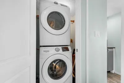 a washing machine and a dryer in a room at Pinnacle Port A-910 in Panama City Beach