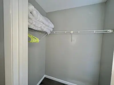 a closet with a curtain and a towel rack at Beach Haven - Seasonal Hot Tub, Fire Pit, BBQ, 700 Feet to Beach, Central PCB, FREE Daily Activities, & More! in Panama City Beach