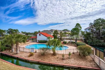 an image of a swimming pool at a resort at St Thomas Square Villa 414 in Panama City Beach