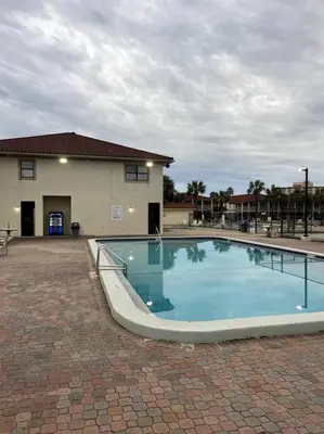 a large swimming pool in front of a building at Lazy Palm 4 Pools Short Walk To Beach! Sleeps 5! in Panama City Beach