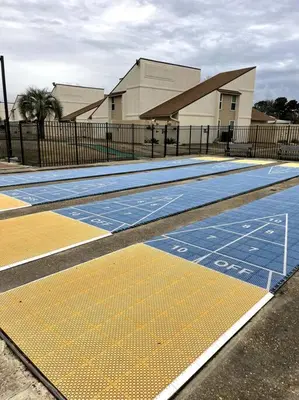 an empty swimming pool in front of a building at Lazy Palm 4 Pools Short Walk To Beach! Sleeps 5! in Panama City Beach
