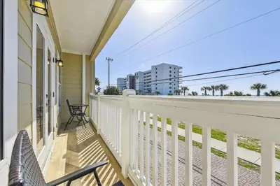 a balcony with a view of the beach and buildings at Second Wind by Book That Condo in Panama City Beach