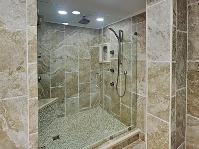 a bathroom with a shower with a glass door at Edgewater Leeward #500 in Panama City Beach