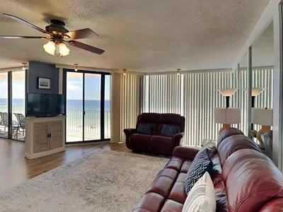 a living room with a couch and a television at Edgewater Leeward #500 in Panama City Beach